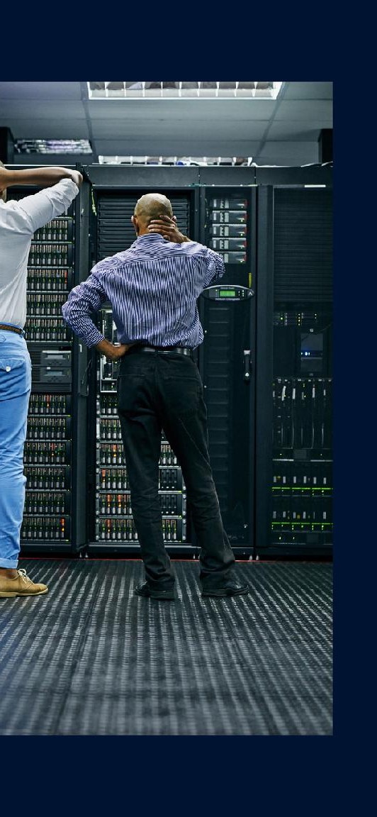 Engineers inspecting a server / control room installation